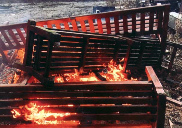 Memorial benches from Edinburgh's Princes Street Gardens are burned at a facility on the outskirts of the city