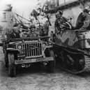 Dwight Eisenhower is driven in a jeep to visit the Italian war front. Picture: Getty