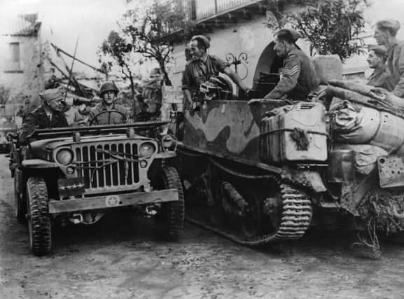 Dwight Eisenhower is driven in a jeep to visit the Italian war front. Picture: Getty