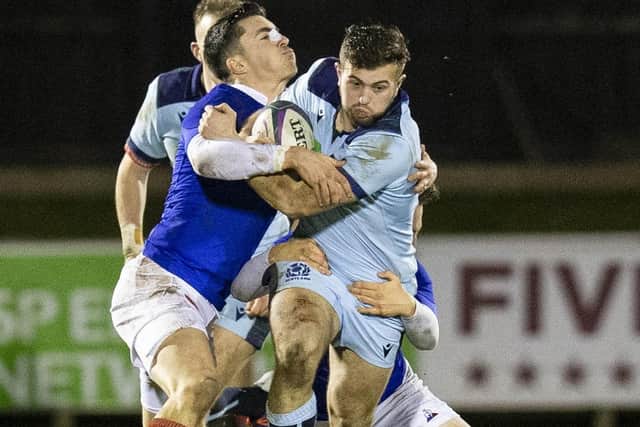 Scotland’s Robbie McCallum is tackled by Thibault Debaes of France during the Netherdale clash. Picture: Bruce White/SNS