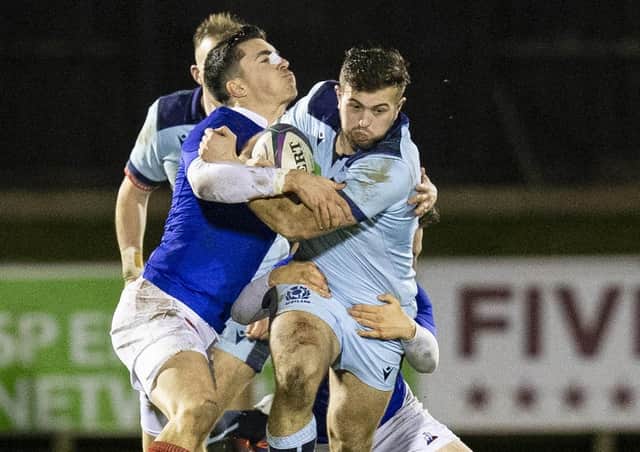 Scotland’s Robbie McCallum is tackled by Thibault Debaes of France during the Netherdale clash. Picture: Bruce White/SNS