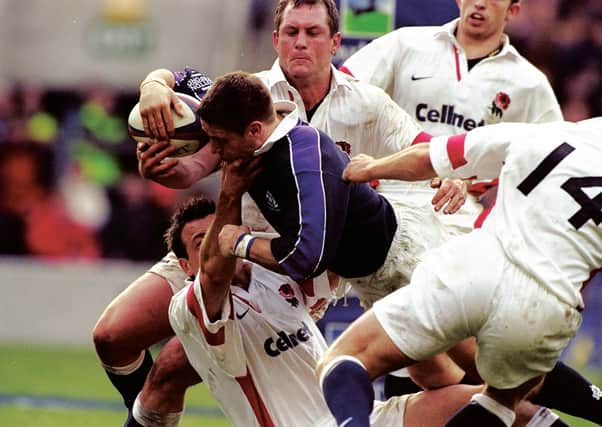 Alan Tait's superb try against England in the 1999 Five Nations is rarely shown on TV because the game was broadcast by Sky. Picture: David Rogers /Allsport