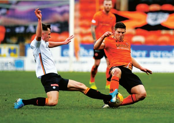 Dundee United's Dillon Powers, right, was on target against Partick Thistle. Picture: Ross MacDonald / SNS