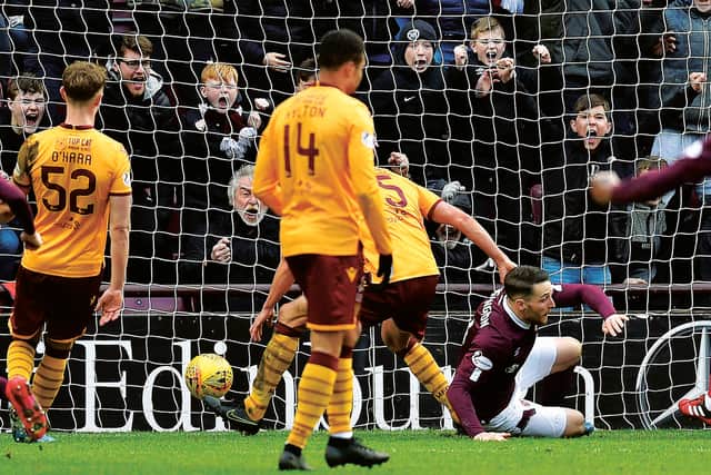Conor Washington nets the equaliser but Hearts missed two late chances to snatch all three points. Picture: SNS Group