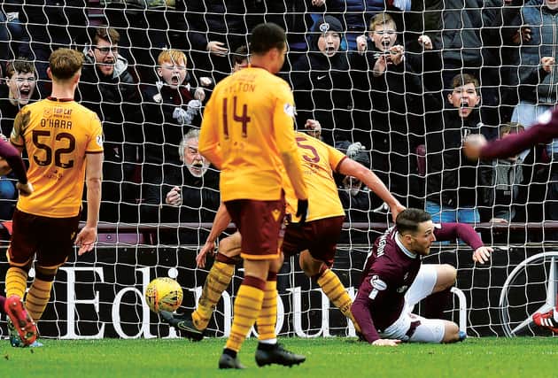 Conor Washington nets the equaliser but Hearts missed two late chances to snatch all three points. Picture: SNS Group