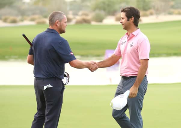 David Drysdale, left, congratulates Jorge Campillo at the end of their play-off in the Qatar Masters. Picture: Warren Little/Getty