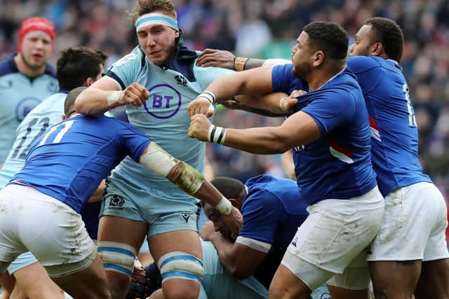 Mohamed Haouas of France takes a swing at Scotland's Jamie Ritchie to land himself in deep trouble at BT Murrayfield. Picture: David Rogers/Getty Images