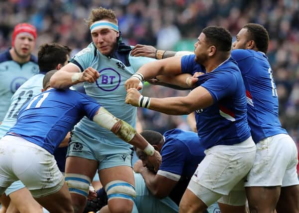 Mohamed Haouas of France takes a swing at Scotland's Jamie Ritchie to land himself in deep trouble at BT Murrayfield. Picture: David Rogers/Getty Images