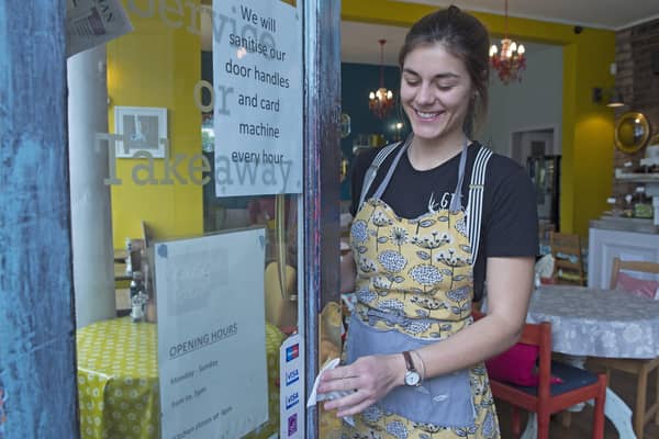 Staff at Piecebox cafe in Polworth putting out anti-bacterial wipes and regularly cleaning the door handles (Picture: Neil Hanna)