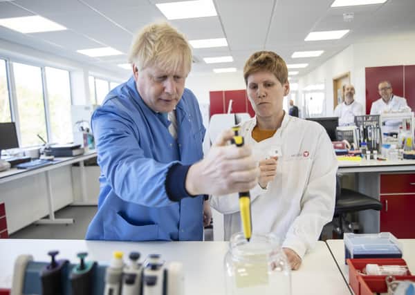 Boris Johnson visits the Mologic Laboratory in Bedford where scientists are working on ways to diagnose coronavirus more quickly (Picture: Jack Hill/Pool/AFP via Getty Images)