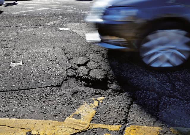 Nine in ten motorists in Scotland and Northern Ireland have been affected by potholes over the last year. Picture: Jon Savage