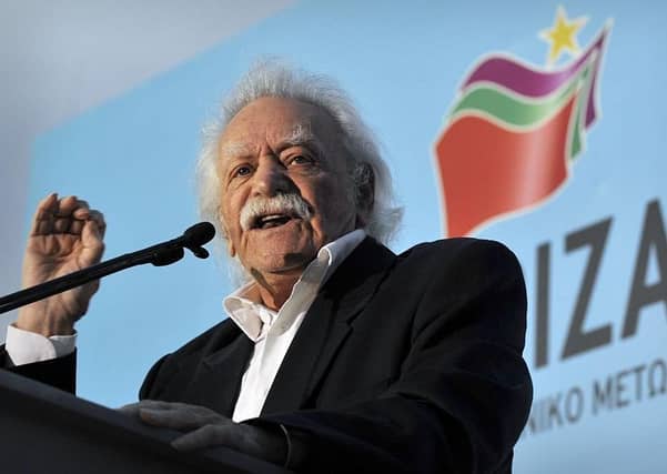 Manolis Glezos addresses at a rally in, 2012. (Picture: LOUISA GOULIAMAKI/AFP via Getty Images)