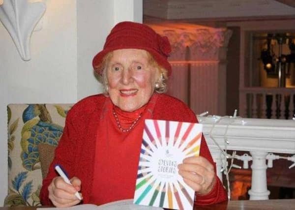 Sylvia Morrison in her trademark red