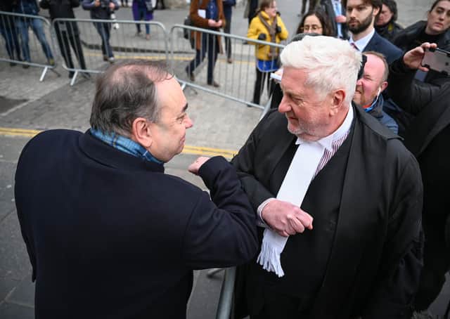 Alex Salmond bumps elbow with Gordon Jackson QC after the former First Minister was cleared of all charges (Picture: Jeff J Mitchell/Getty Images)