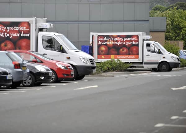Sainsburys delivery vans outside Sainsburys at Cameron Toll.