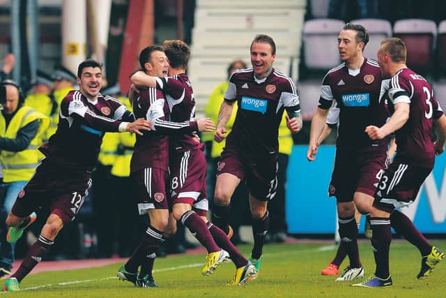 Hearts celebrate after Dale Carrick (2nd from left) opens the scoring against Hibs in the so-called 'relegation derby' in 2014. Picture: SNS