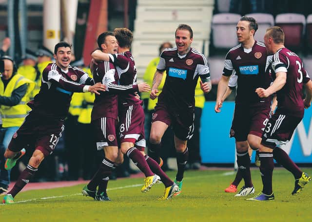 Hearts celebrate after Dale Carrick (2nd from left) opens the scoring against Hibs in the so-called 'relegation derby' in 2014. Picture: SNS