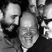 Cuban president Fidel Castro, left, and Soviet leader Nikita Khrushchev hug at the United Nations in this late 1960 file photo. (Picture: Marty Lederhandler/AP)
