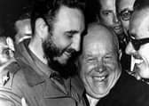 Cuban president Fidel Castro, left, and Soviet leader Nikita Khrushchev hug at the United Nations in this late 1960 file photo. (Picture: Marty Lederhandler/AP)