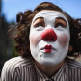 A Fringe entertainer performs on the Royal Mile (Picture: Jeff J Mitchell/Getty Images)