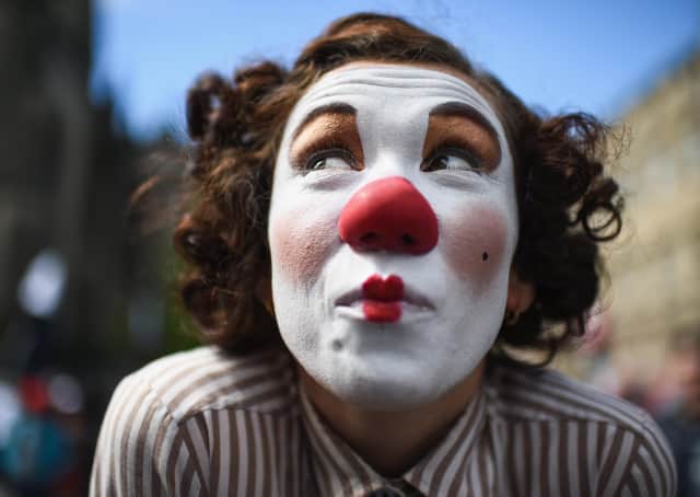 A Fringe entertainer performs on the Royal Mile (Picture: Jeff J Mitchell/Getty Images)