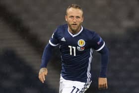 Johnny Russell is making the best of the enforced break from football by spending more time with his family, including  two-month-old baby Julius. Picture: SNS