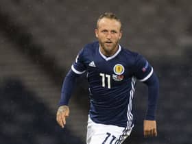 Johnny Russell is making the best of the enforced break from football by spending more time with his family, including  two-month-old baby Julius. Picture: SNS
