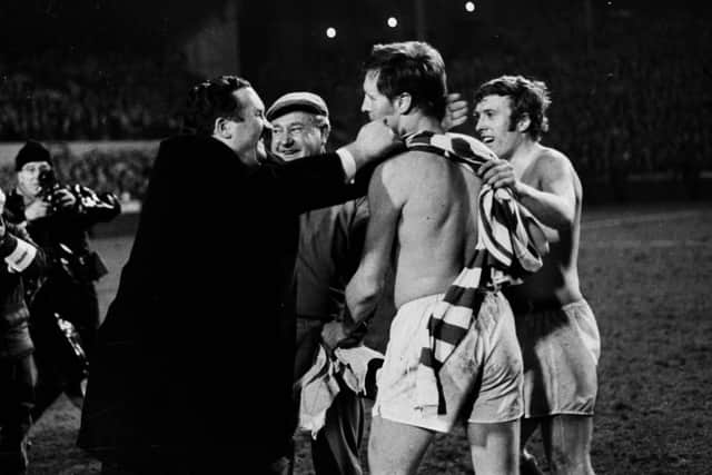 Celtic manager Jock Stein congratulates his captain Billy McNeill after the win at Hampden.