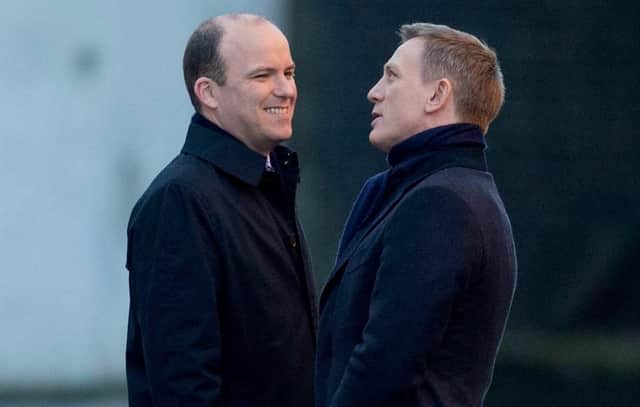 Rory Kinnear (left) chats with Daniel Craig as they film a scene on a London canal for the James Bond movie Spectre. Picture: Matt Dunham/AP/Shutterstock