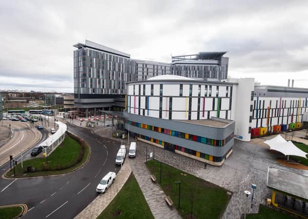 The normally crowded atrium inside the Queen Elizabeth University Hospital in Glasgow now has almost a monastic stillness (Picture: John Devlin)