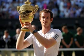 Andy Murray with the trophy after beating Serbia's Novak Djokovic to win the men's singles at Wimbledon in 2013. Picture: Adam Davy/PA Wire
