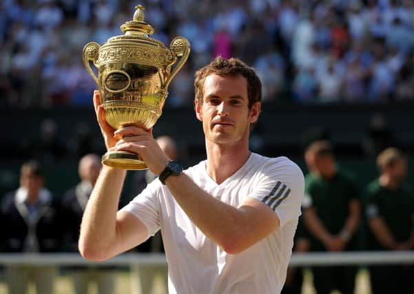 Andy Murray with the trophy after beating Serbia's Novak Djokovic to win the men's singles at Wimbledon in 2013. Picture: Adam Davy/PA Wire