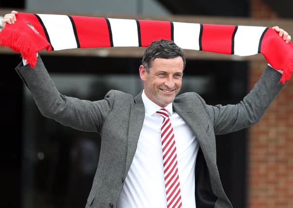 Jack Ross holds a Sunderland scarf aloft on the day he was paraded as the struggling club’s new manager. Picture: Owen Humphreys/PA