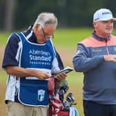 Paul Lawrie, pictured talking over yardage with his caddie Julian Phillips during last year's Aberdeen Standard Investments Scottish Open at The Renaissance Club, believes there are more important things than sport in life at the moment. Picture: Aberdeen Standard Investments