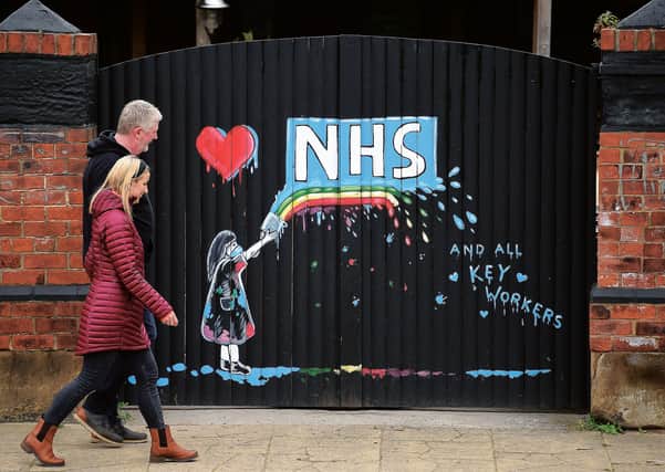A graffiti mural on a gate pays tribute to the NHS in Pontefract, West Yorkshire. Picture: Oli Scarff/Getty