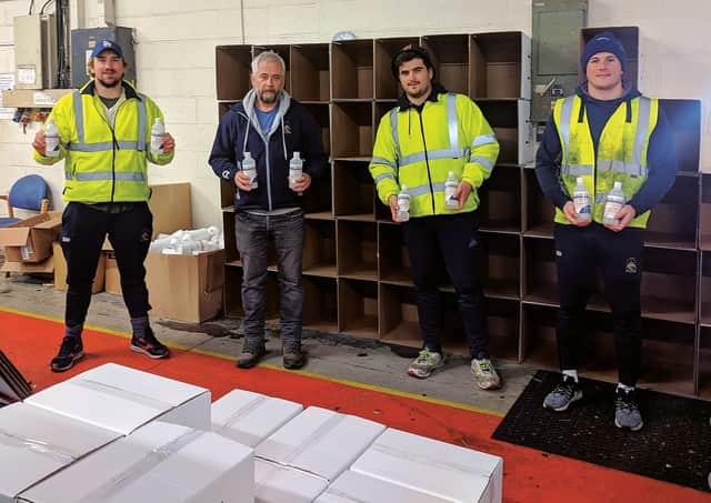 The Marr the merrier: From left to right, Benedict Grant, president Stephen Allam, Brandon Sweet and Scott Bickerstaff helping produce sanitising gels.