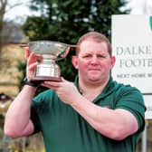 Steven Halliday, president of Dalkieth Rugby Club, has already got his hands on the silverware. Picture: Ian Georgeson