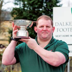 Steven Halliday, president of Dalkieth Rugby Club, has already got his hands on the silverware. Picture: Ian Georgeson