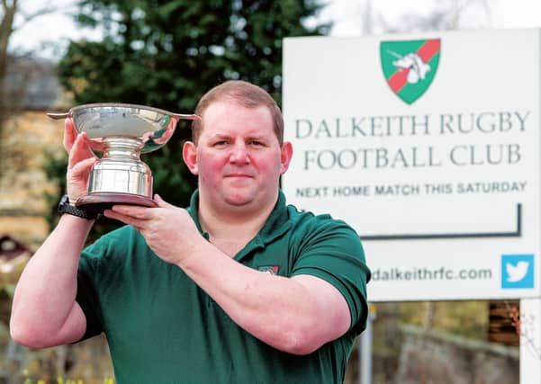 Steven Halliday, president of Dalkieth Rugby Club, has already got his hands on the silverware. Picture: Ian Georgeson