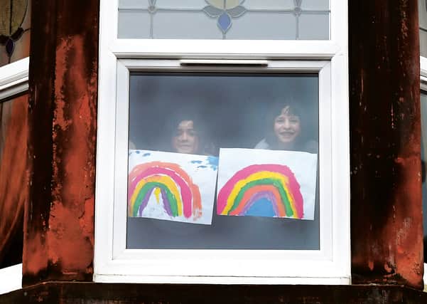 Children in Glasgow put paintings of rainbows in the window to raise the spirits of passers-by. Picture: 
John Devlin