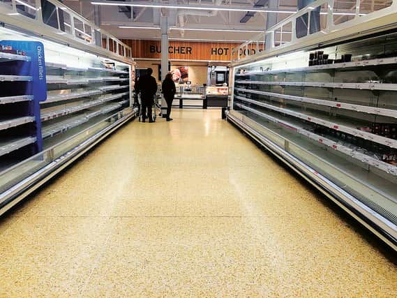 Empty shelves at Sainsbury's in Blackhall, Edinburgh. Panic buyers have stripped the supermarket shelves of food, soap and toilet rolls as fears rise over the spread of the Coronavirus