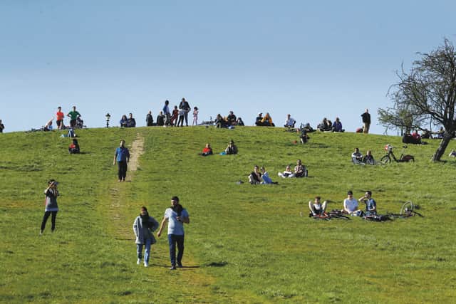People observe social distancing on Primrose Hill in London. Picture: AP Photo/Matt Dunham