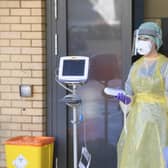 An emergency department Nurse during a demonstration of the Coronavirus pod and Covid-19 virus testing procedures. Picture: Michael Cooper/PA Wire
