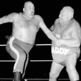 Big Daddy, on the right in a bout against Mal Kirk, was a hero of British wrestling in the 1970s