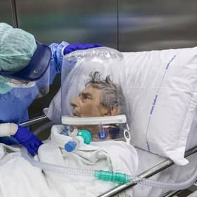 A nurse attends to a Covid-19 patient being moved out of intensive care in a hospital in Bergamo, Italy (Picture: Marco di Lauro/Getty Images)