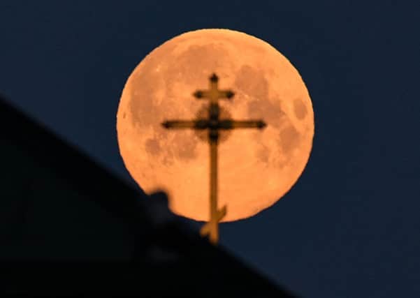 A supermoon, or pink moon, have proved a lockdown talking point (Picture: Kirill Kudryavtsev/AFP via Getty)