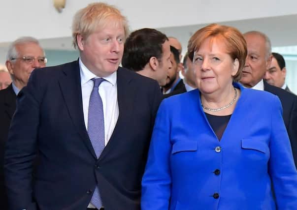 Prime Minister Boris Johnson and German Chancellor Angela Merkel at a summit in Berlin in January (Picture: Tobias Schwarz/AFP via Getty Images)
