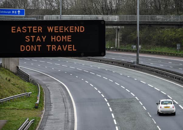 An overhead sign on the M8 advises people not to travel this Easter weekend. Picture: Jeff J Mitchell/Getty