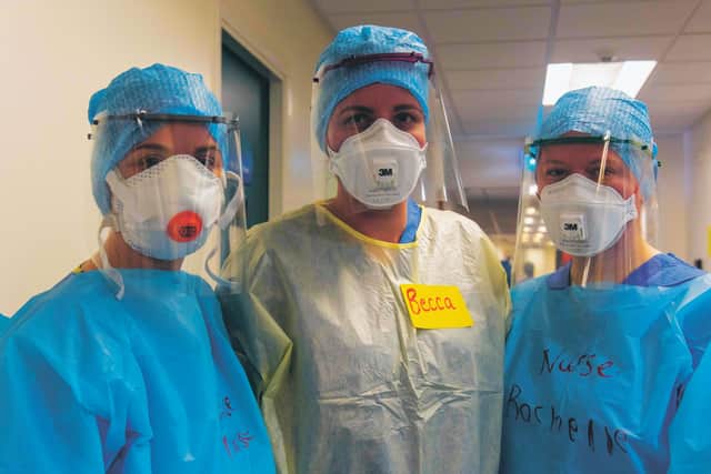Doctors and nurses prepare to enter the Covid ward putting on the PPE safety equipment