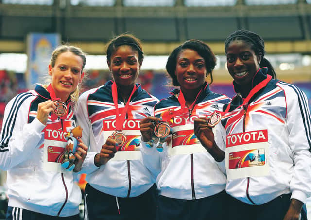 Eilidh Child, left, and her team-mates Christine Ohuruogu, Shana Cox and Margaret Adeoye receive their bronze medals after the 4x400m relay at the 2013 World Championships in Moscow. Picture: Paul Gilham/Getty Images)